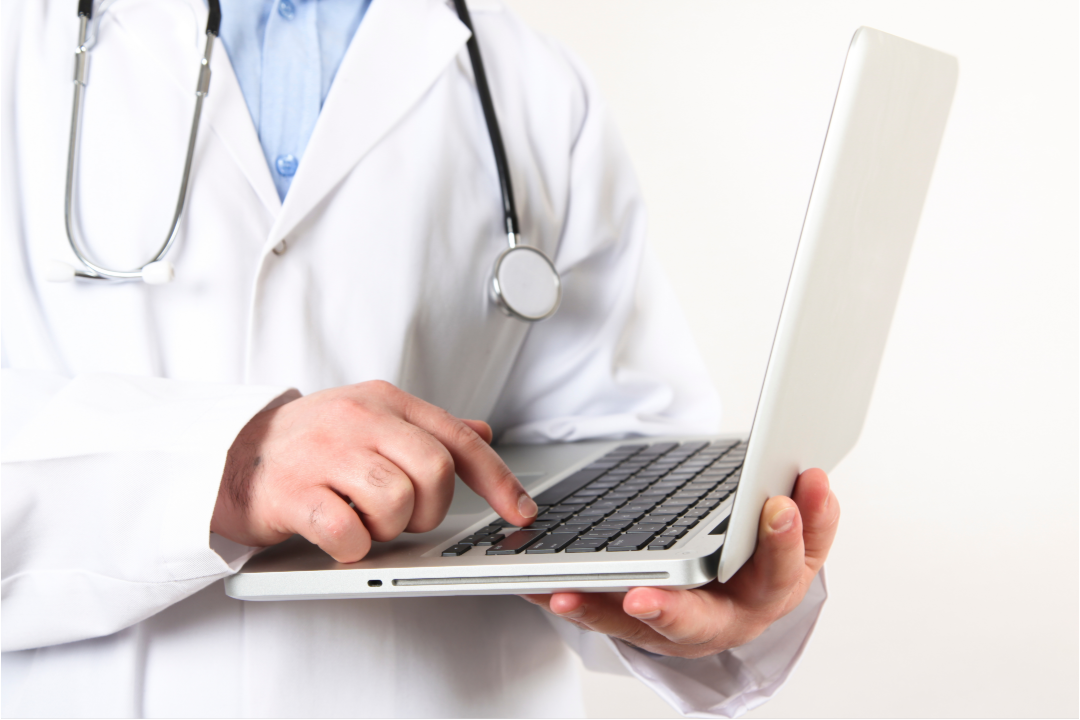 provider holding laptop and typing