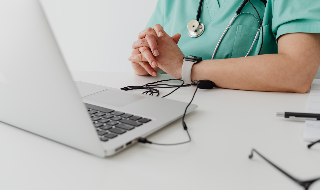 Provider sitting near a laptop
